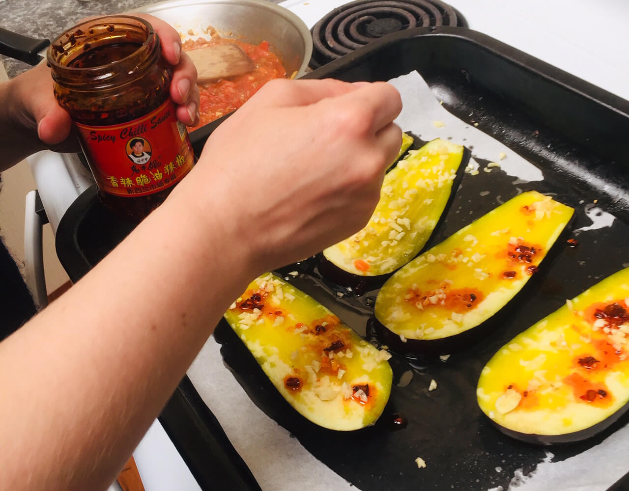 The sauce being applied to one of the three foods that I can cook